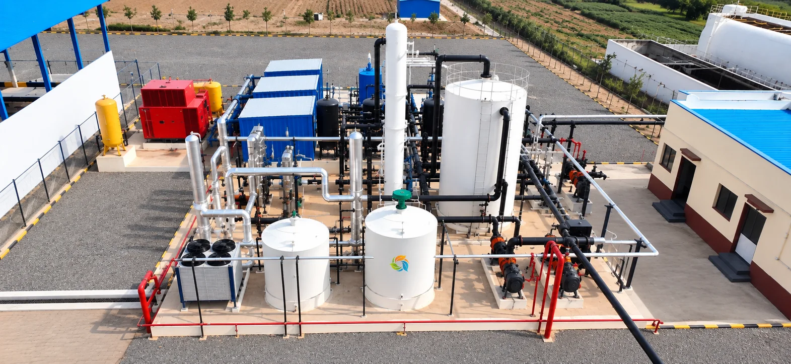 Bharat Bioenergy turnkey CBG plant exterior with digester domes and feedstock handling equipment